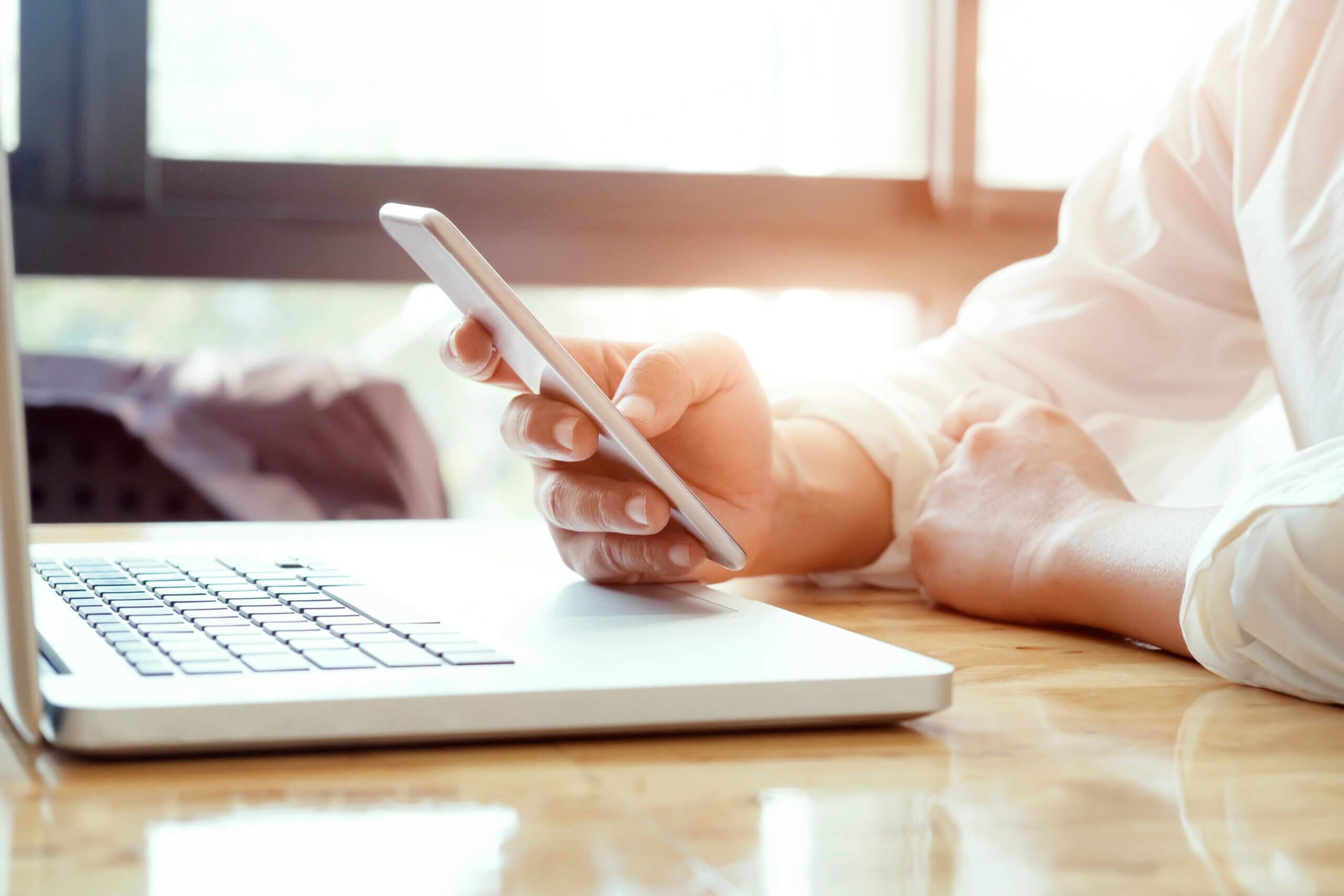 Businessman Using Laptop Mobile Phone Scaled